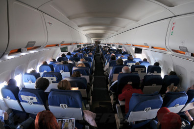 a group of people sitting in an airplane