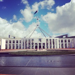 Parliament House, Canberra with a flag on top