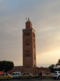 a tall tower with Koutoubia Mosque in the background