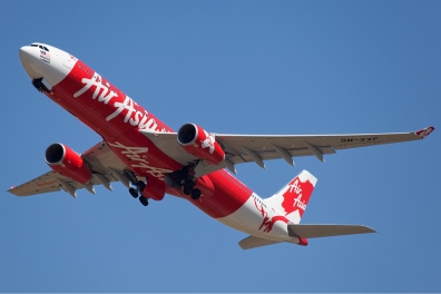 a red and white airplane flying in the sky