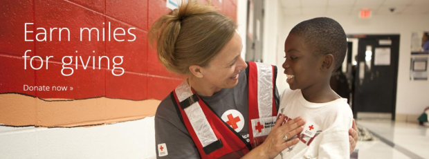 a woman in a red cross vest