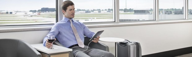 a man sitting in an office with a tablet
